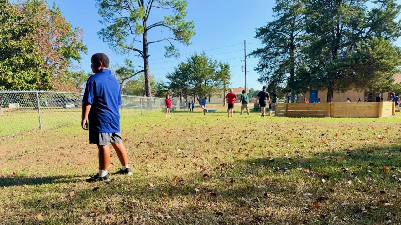Cypress Bend Students playing capture the flag on the playground close to the gaga ball pit.